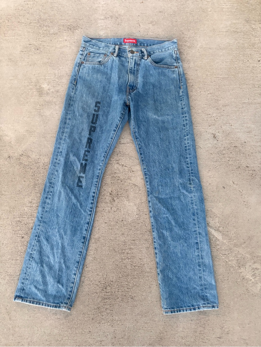 Supreme Light Blue Straight-Leg Jeans with Vertical Logo